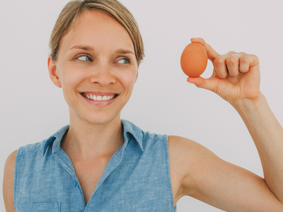 woman holding an egg